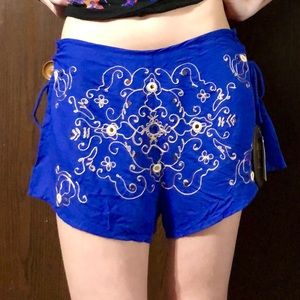 Anna Sui for O’Neill. Blue shorts with gold detail
